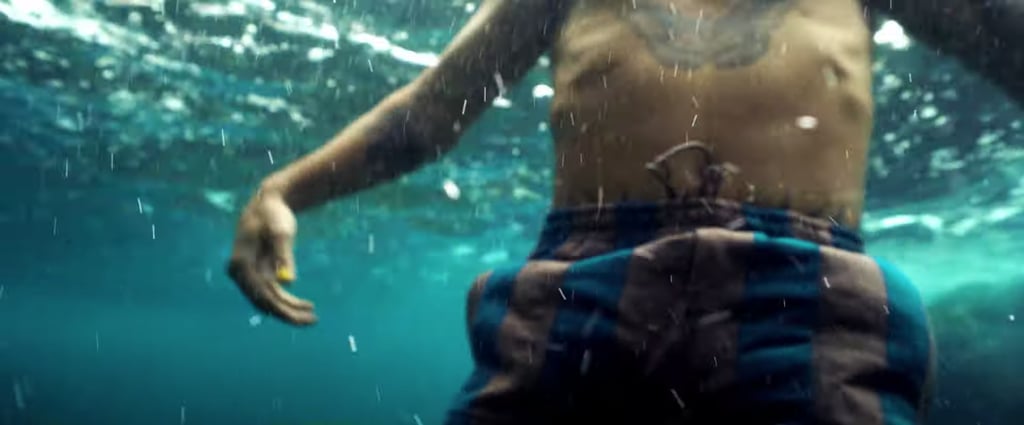 Here's a zoomed-in underwater look at his swimwear — and his amazing butterfly ink.