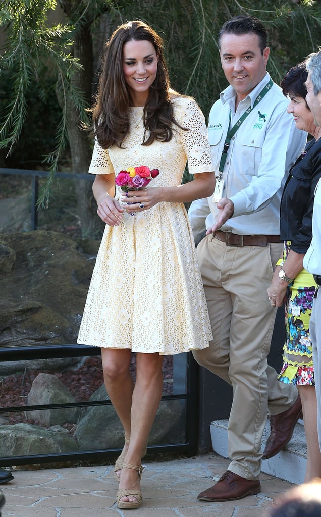 Mystery designer in Sydney: The independent designer of this pale yellow eyelet dress has never been revealed, but it has become a favourite of Kate's. Worn in Sydney with tan 'Minx' Stuart Weitzman wedges.