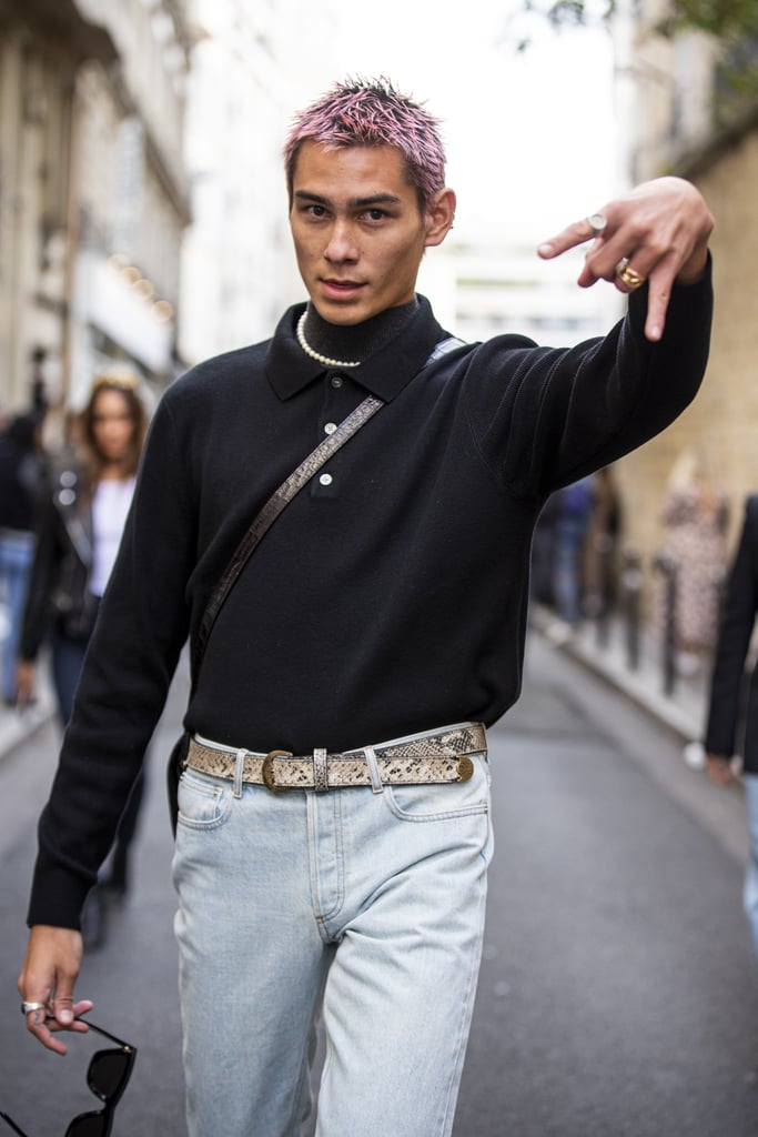 Wearing a black sweater and light jeans outside the APC show during Paris Fashion Week in 2019.