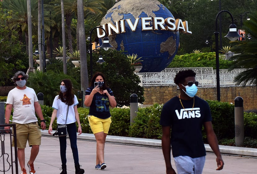 ORLANDO, UNITED STATES - MAY 14, 2020: Guests wearing face masks visit the Universal Orlando's CityWalk as sections of the entertainment and retail district opened today for limited hours for the first time since Universal Orlando closed on March 15, 2020