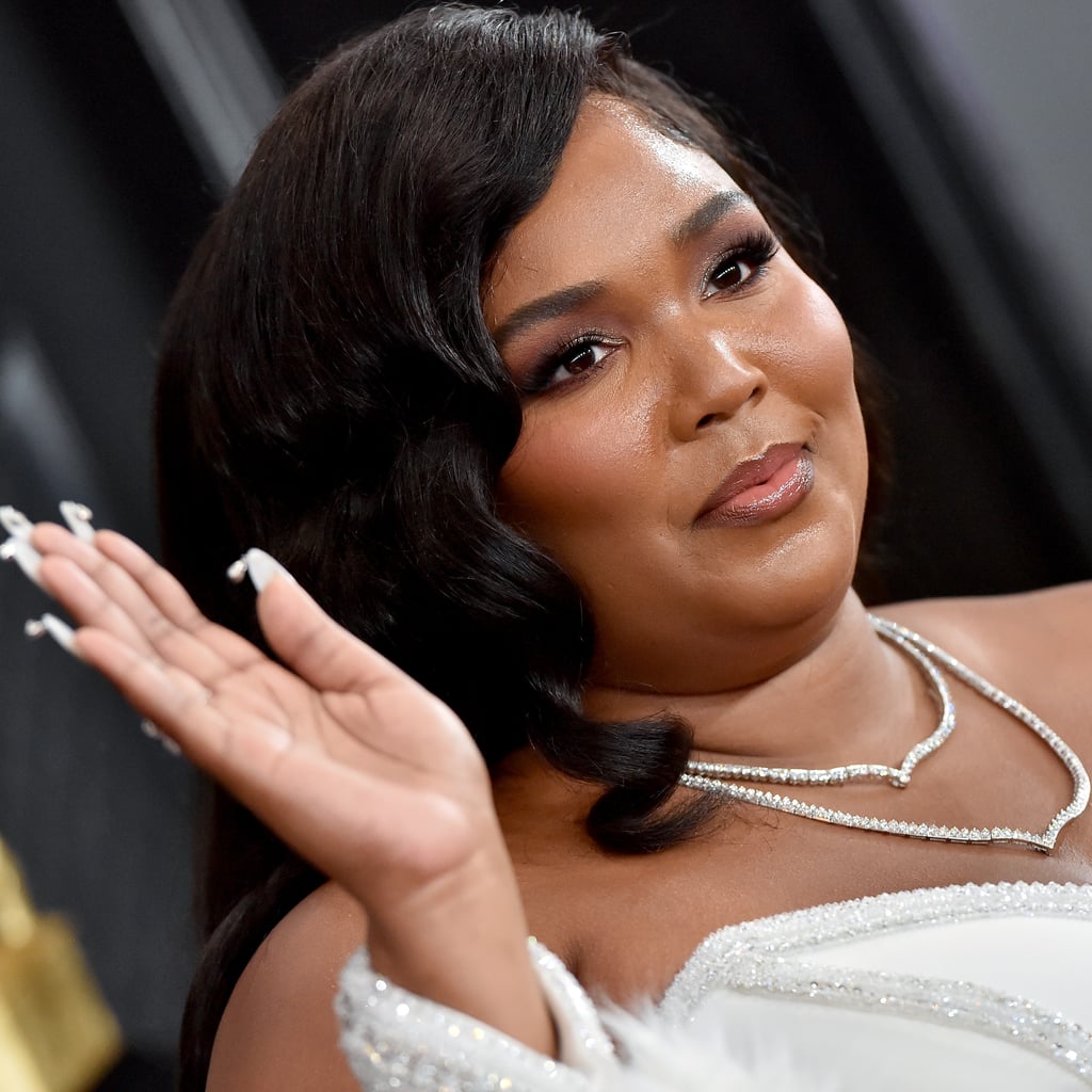 Lizzo Vacations in a Tiny String Bikini and Moon Boots