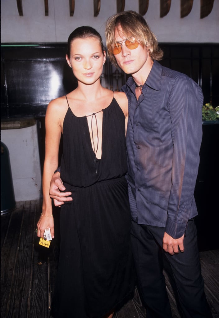 At a magazine launch party with Anthony Langdon in 1999, wearing a jersey dress with cowl front.