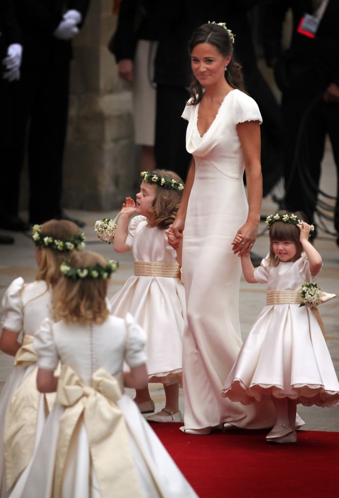Wearing her famous Alexander McQueen bridesmaid dress at the royal wedding.