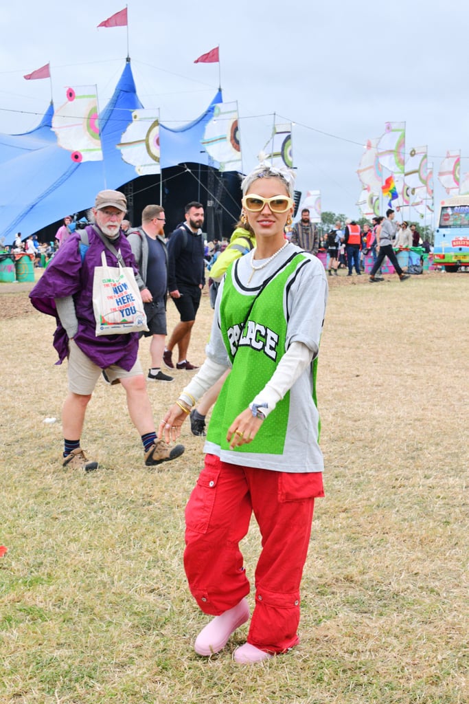 Iris Law Wearing a Green Jersey Tee and Red Cargos at Glastonbury