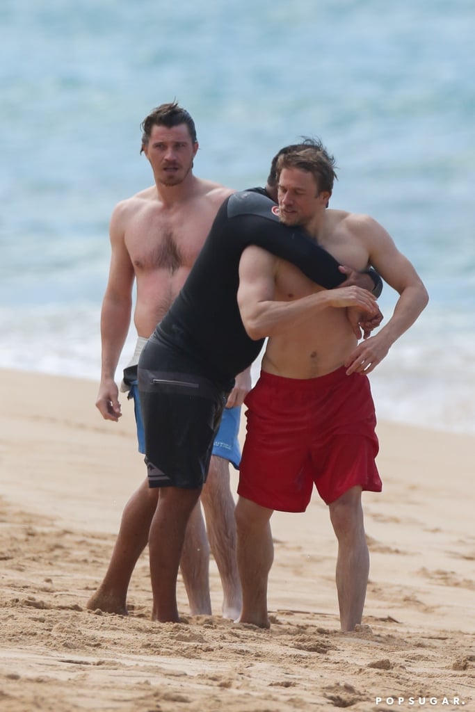 Charlie Hunnam and Garrett Hedlund Wrestle in Hawaii Photos