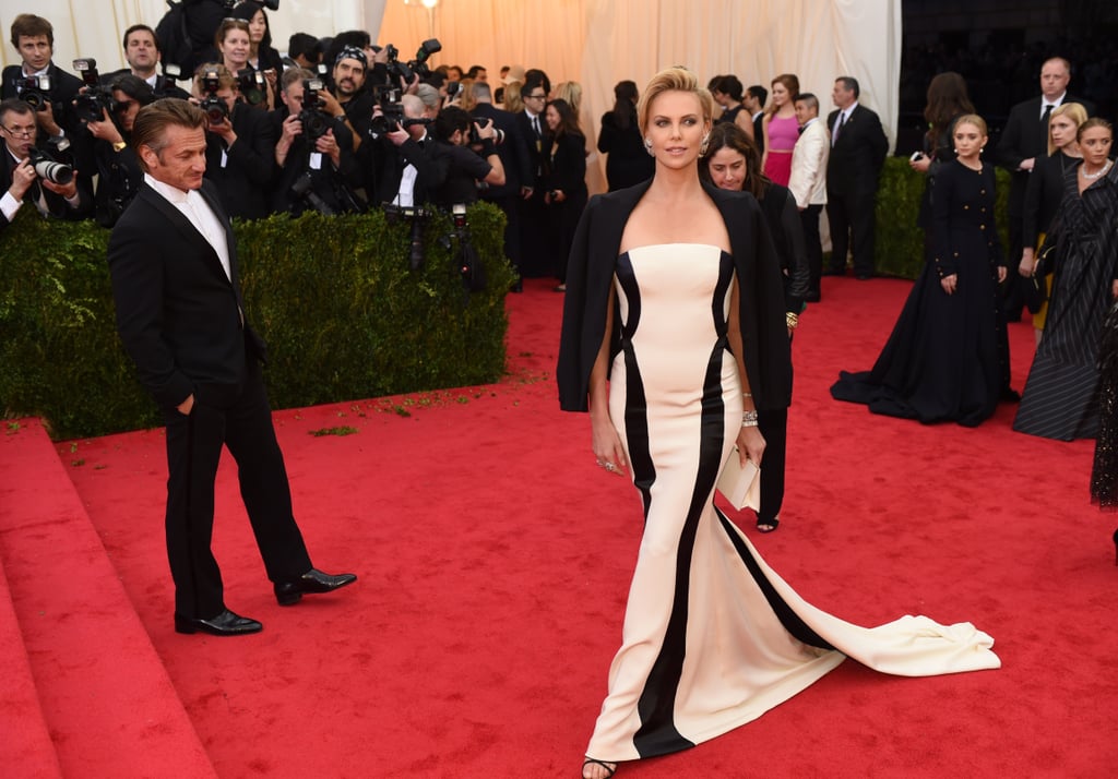 What was Sean Penn looking at as Charlize Theron showed off her dress?