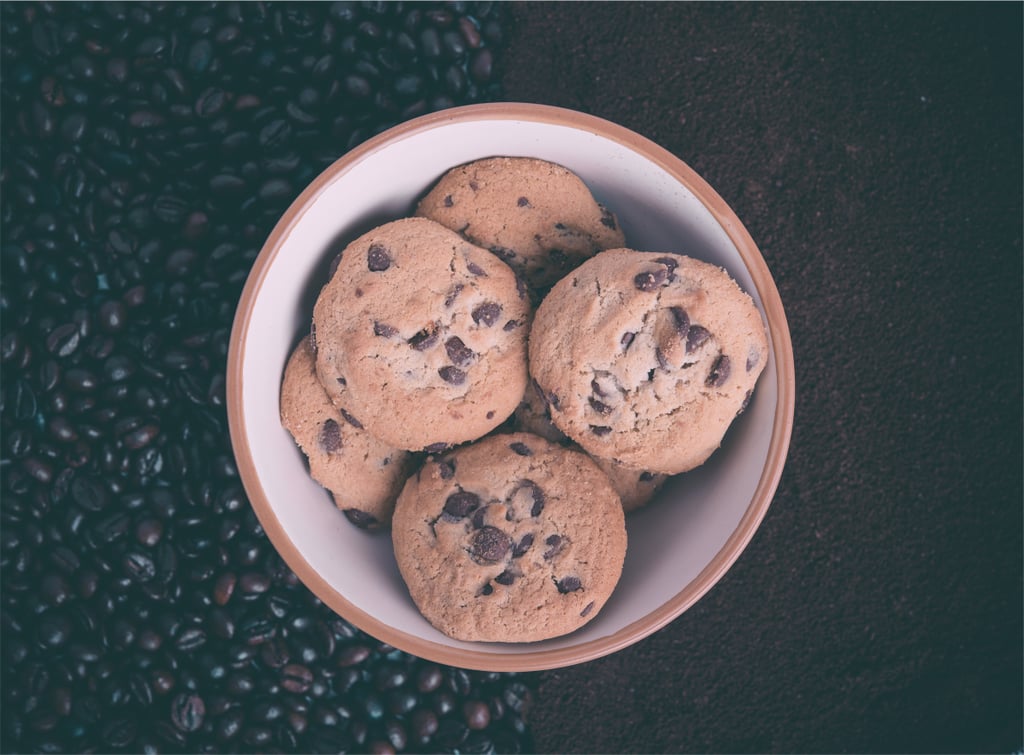 Eating freshly baked cookies.