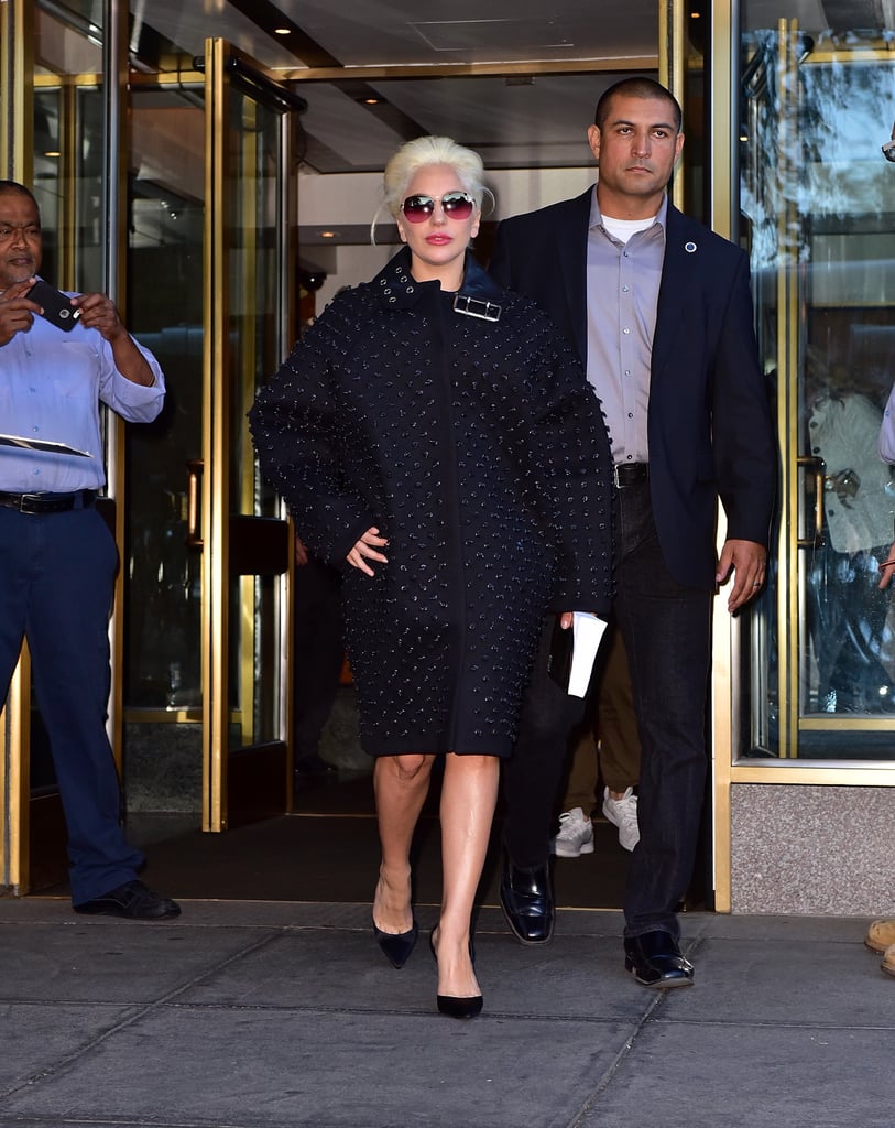 A coat that covers her body? Yep, she wore one! We're loving the feminine black topper Lady Gaga rocked while out in NYC.