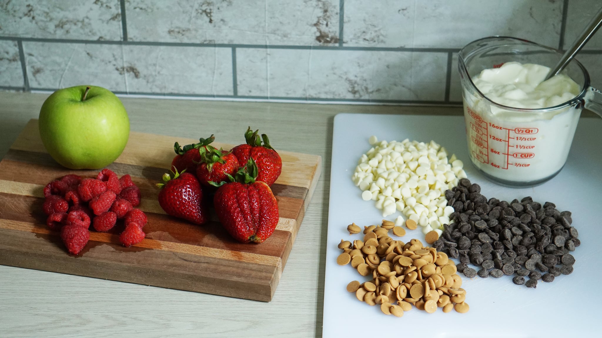 ingredients for chocolate-covered strawberry yoghurt clusters and peanut butter apple yoghurt clusters