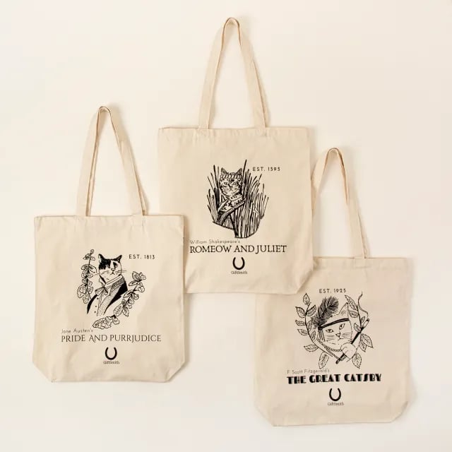 Uncommon Goods Classic Literature Cat Tote ($25) 
"You can never have too many reusable bags in your home or car, and this accessory is especially fun for cat owners who also appreciate the classics. Each bag features reimagined titles of classic literature like 'The Great Gatsby' or 'Romeo and Juliet' — but with a feline-friendly twist. Plus, it doubles as a great bag to carry any cat toys or bulky cat-food bags." — KW