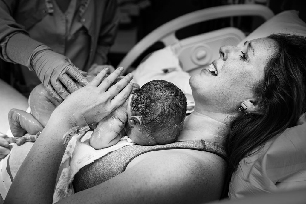"Although I do a lot of home births and birth-center births, I love working with families who choose to have their babies at a hospital. They are just as beautiful and just as powerful. One of my favorite moments to capture during a birth (regardless of where it takes place) is the moment baby comes into mom’s arms."