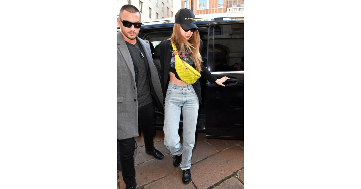 Versace - Gigi Hadid masters the airport style carrying the brand new black  #VersaceDV1 bag.
