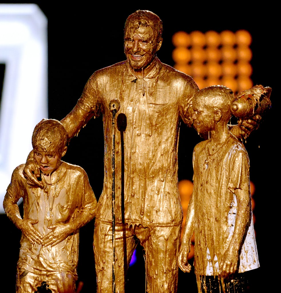 David Beckham and his kids got slimed with gold at the Nickelodeon Kids' Choice Sports Awards on Thursday in LA.