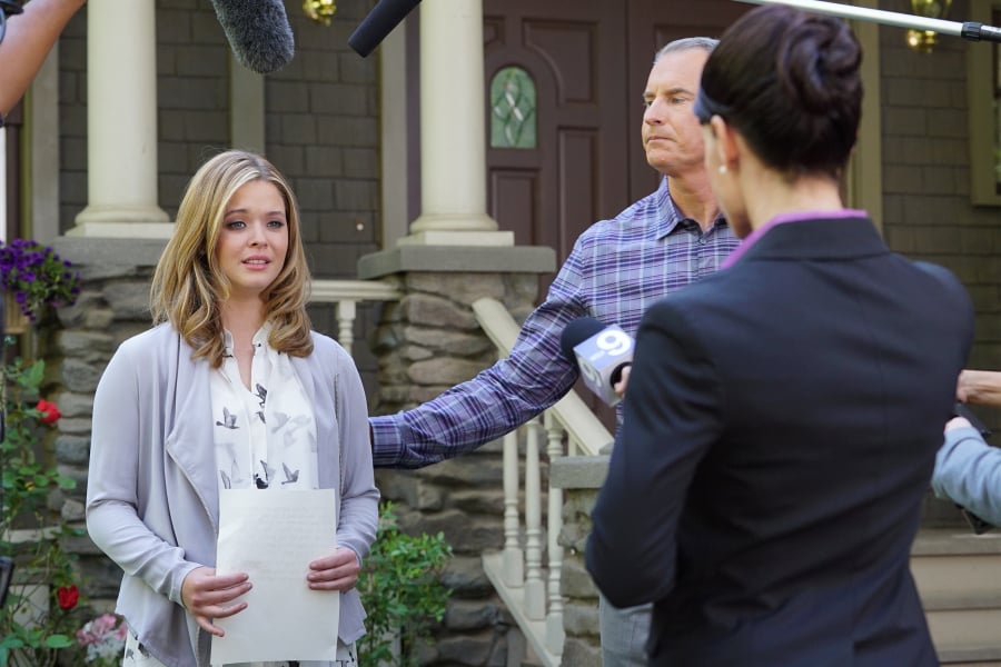 Alison (Sasha Pieterse) holds a press conference.