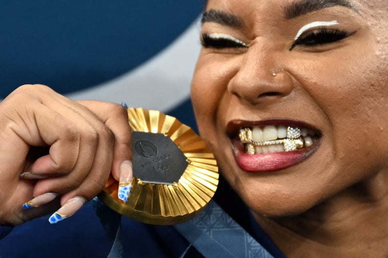 US' Jordan Chiles poses with the gold medal after the podium ceremony for the artistic gymnastics women's team final during the Paris 2024 Olympic Games at the Bercy Arena in Paris, on July 30, 2024. (Photo by Lionel BONAVENTURE / AFP) (Photo by LIONEL BO