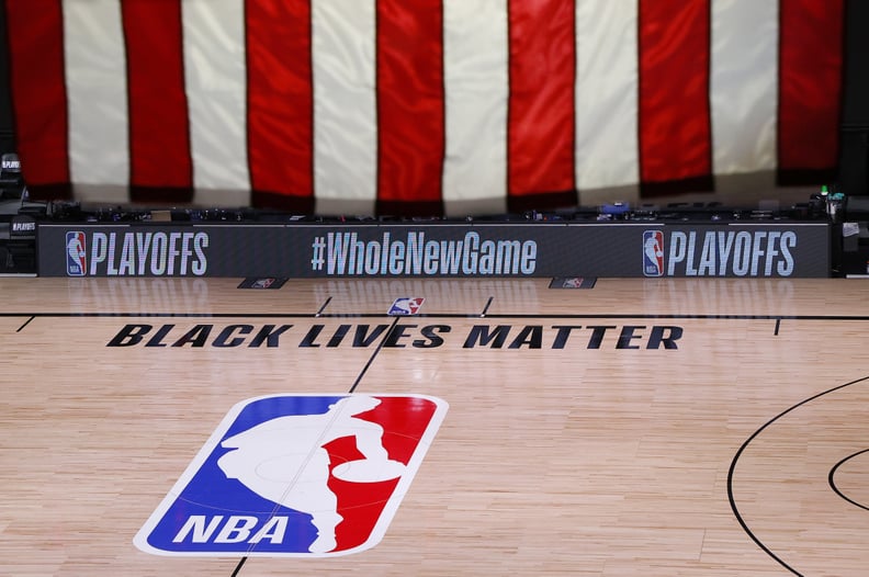 LAKE BUENA VISTA, FLORIDA - AUGUST 26: An empty court and bench is shown following the scheduled start time in Game Five of the Eastern Conference First Round between the Milwaukee Bucks and the Orlando Magic during the 2020 NBA Playoffs at AdventHealth A