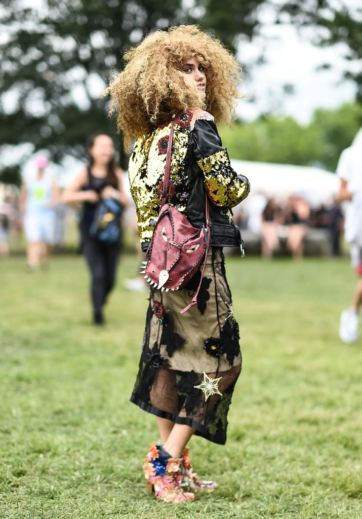To make your outfit stand out, don't go for that simple pair of boots. This street style star took a chance with her multicolored and embellished shoes, which happened to perfectly match the floral details on her sheer dress. And that sequined jacket? It added a nice, glittery touch.