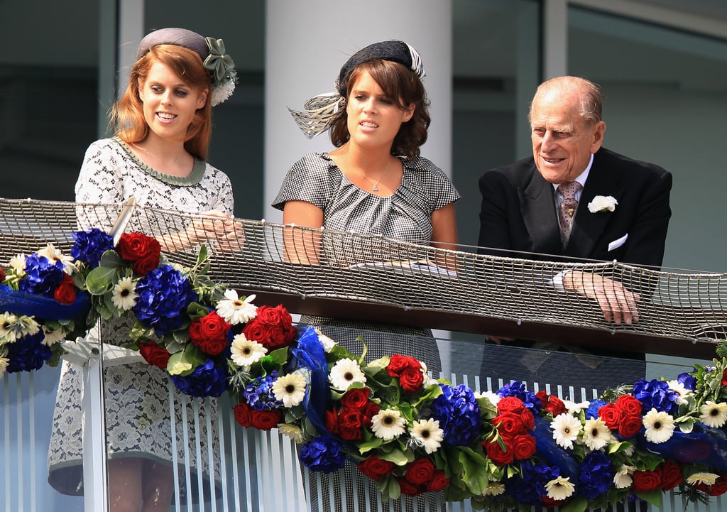 With her sister, Princess Eugenie, and their grandfather Prince Philip at the Investec Derby in 2012.