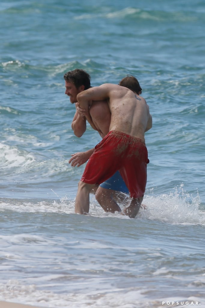 Charlie Hunnam and Garrett Hedlund Wrestle in Hawaii Photos