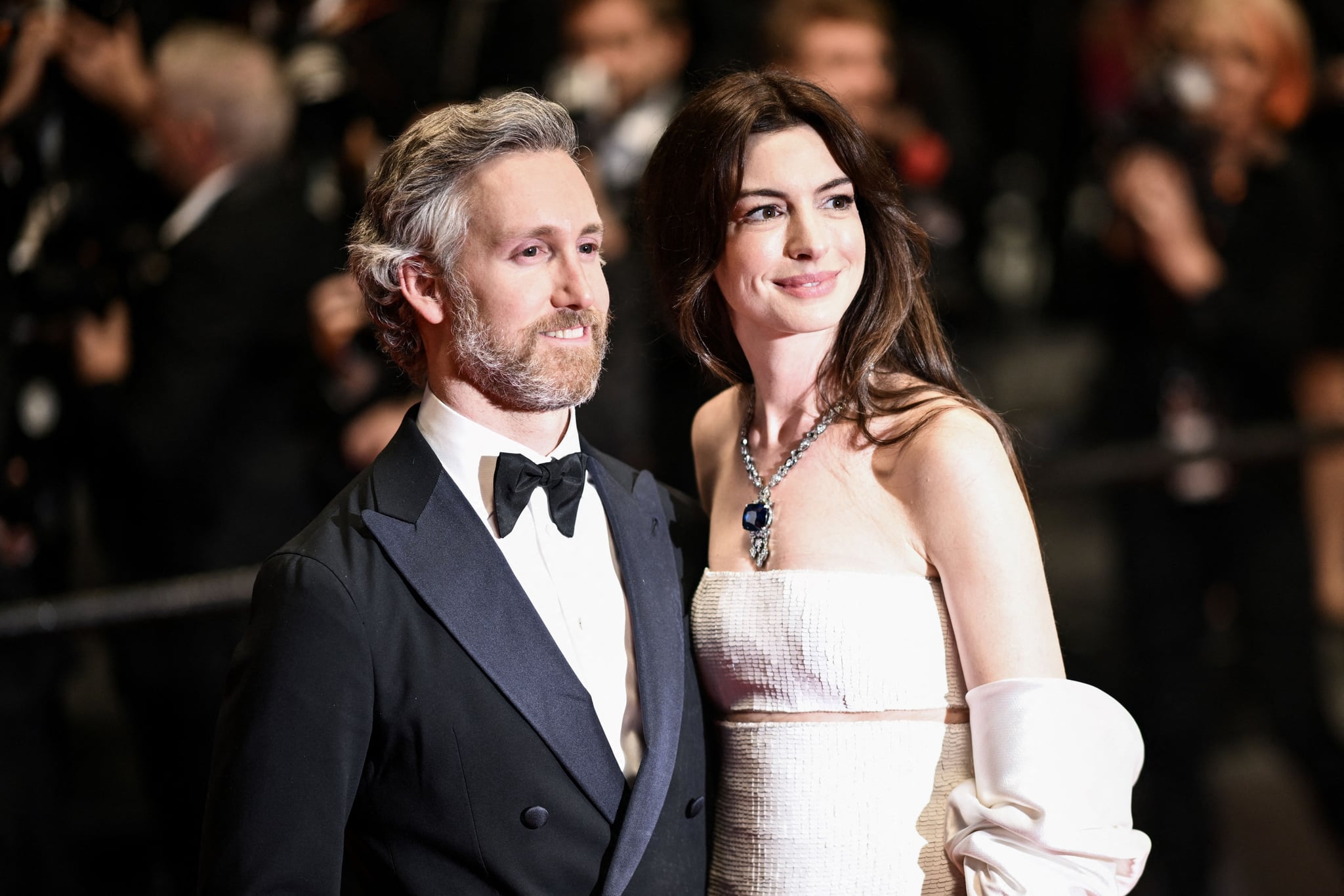 US actress Anne Hathaway and her husband Adam Shulman pose as they leave the Festival Palace following the screening of the film 