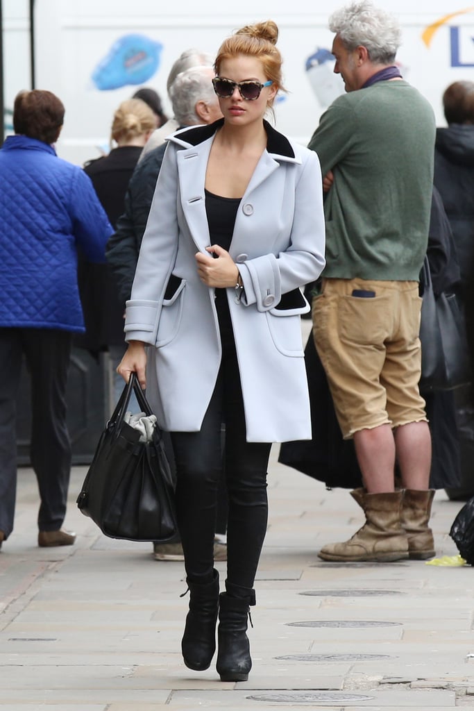 Margot Robbie dyed her hair red, showing off her new look in London on Friday.