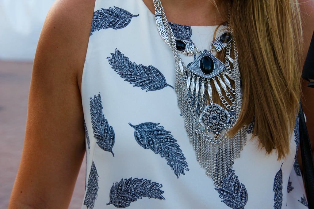 So what if you can't decide between a bold feather-print tank and an attention-grabbing statement necklace — wear them both together for a mix-and-match vibe.