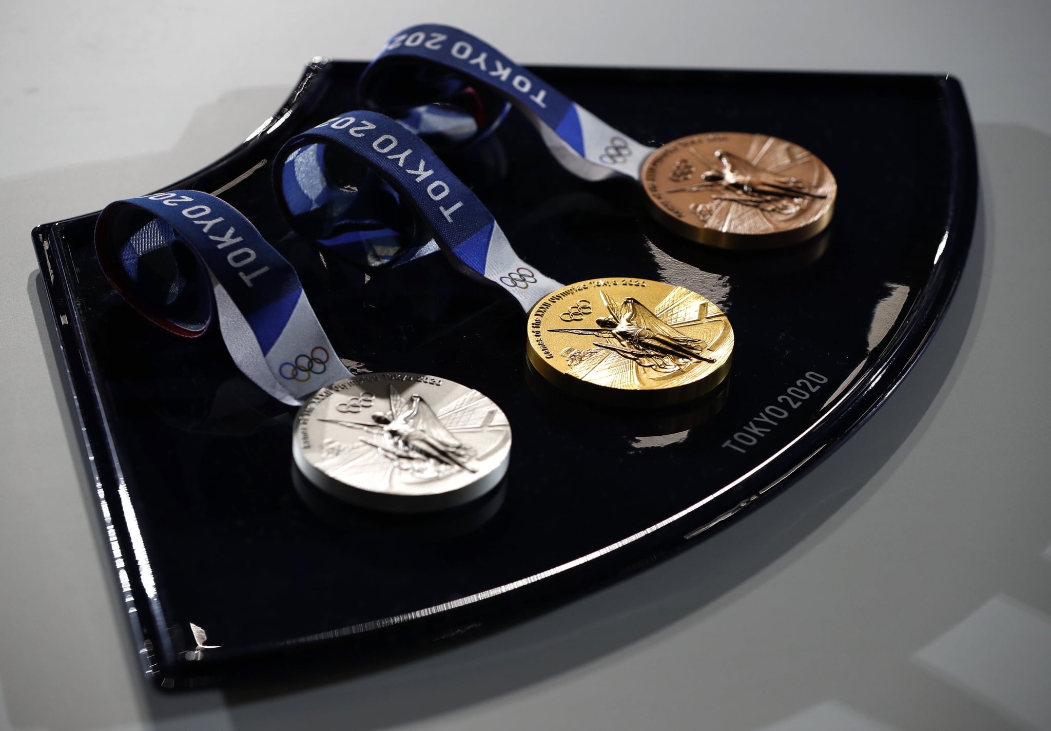 TOKYO, JAPAN - JUNE 03: A medal tray that will be used during the victory ceremonies at the Tokyo 2020 Olympic Games is displayed during an unveiling event for the victory ceremonies' items including podium, music, costume and the medal tray for the Olympic and Paralympic games at the Ariake Arena on the day marking the 50 days to go to the Tokyo Olympic Games opening ceremony on June 3, 2021 in Tokyo, Japan. (Photo by Issei Kato - Pool/Getty Images)