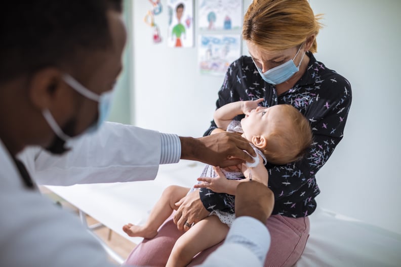 Close up of a pediatrician vaccinating his patient