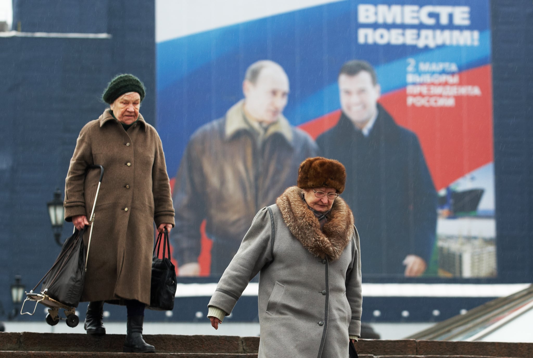 Putin with likely successor Dmitry Medvedev. Poster says "Together we will win!" Putin with likely successor Dmitry Medvedev. Poster says "Together we will win!"