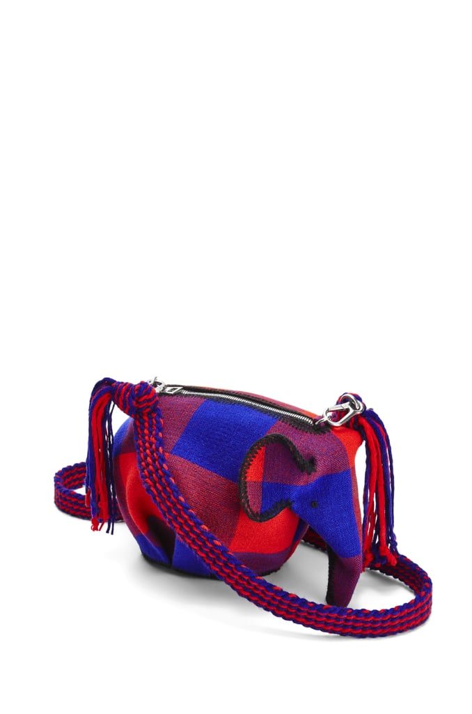 Shop Loewe's Exclusive Elephant Knot On My Planet Bag in Textile ($1,650). The shoulder bag comes with a detachable strap, the option of adding custom charms, and "LOEWE X Knot On My Planet" embossed on the base. 100 percent of proceeds from each sale go to the Elephant Crisis Fund, which works to safeguard the future of elephants.