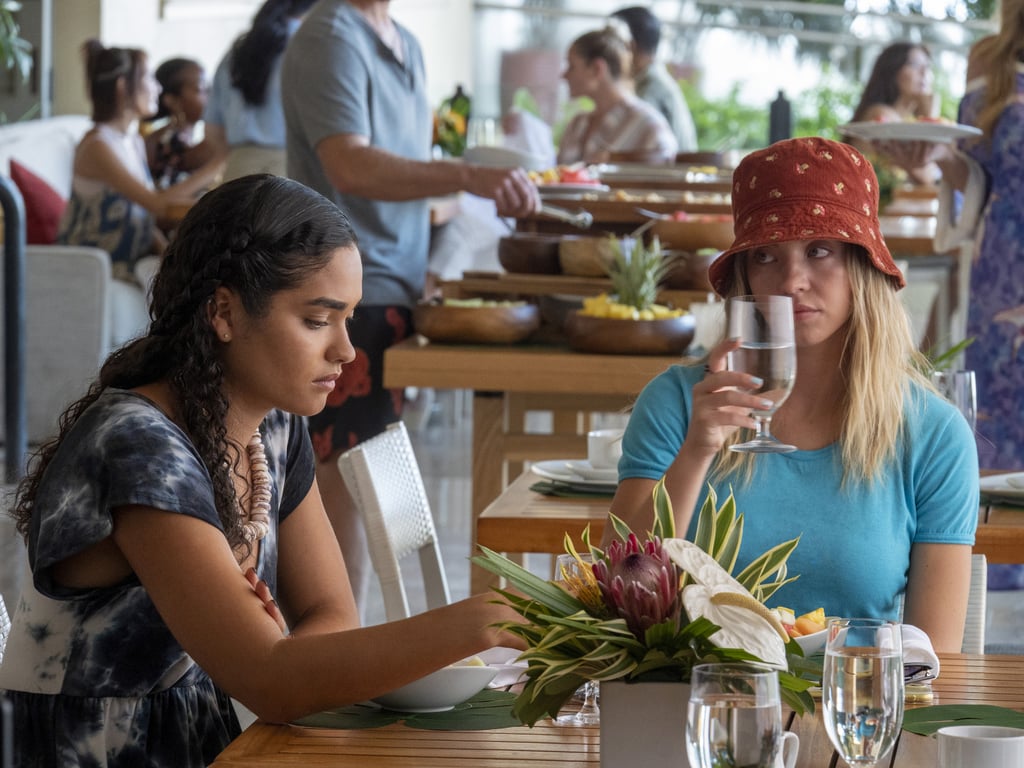 Olivia's corduroy mushroom bucket hat, originally from Urban Outfitters, is a casual contrast to her blue tee, while Paula, becoming more independent, opts for a swingy tie-dye dress.