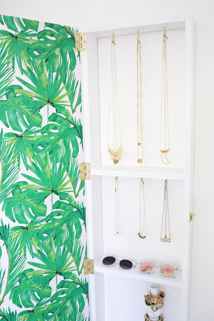You know that inexpensive, lightweight floor-length mirror you've held on to since college? Well, pat yourself on the back for keeping it because this genius DIY jewelry cabinet needs to happen.