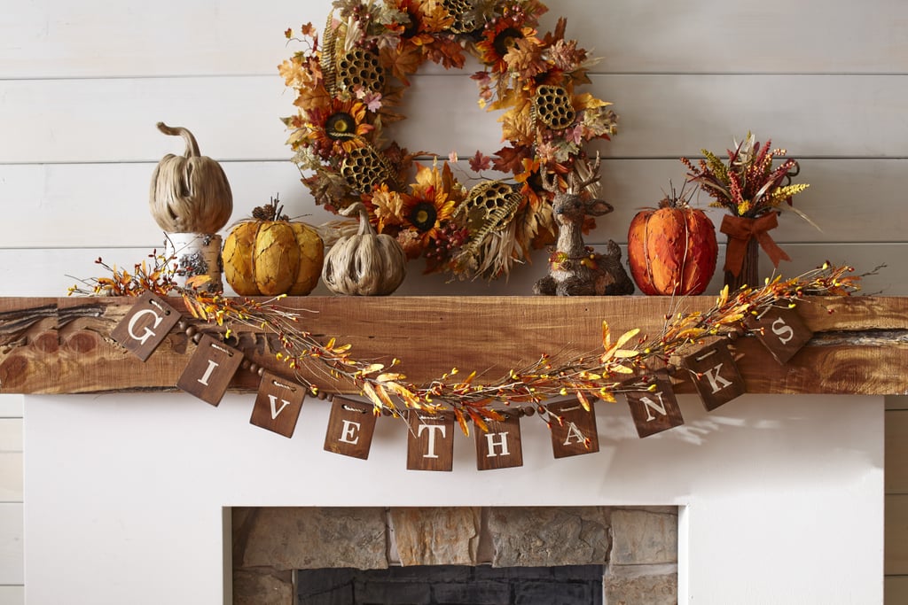 Wooden Block Garland ($35) and Faux Cornhusk & Sunflower Wreath ($70)