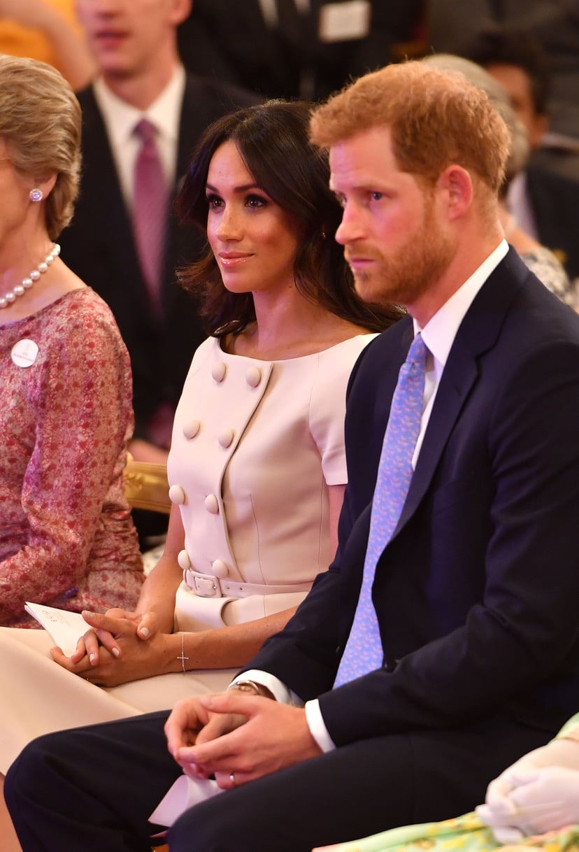 LONDON, ENGLAND - JUNE 26: Prince Harry, Duke of Sussex and Meghan, Duchess of Sussex at the Queen's Young Leaders Awards Ceremony at Buckingham Palace, London.   (Photo by John Stillwell - WPA Pool/Getty Images)