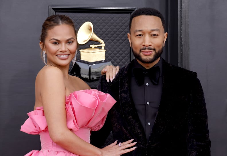 LAS VEGAS, NEVADA - APRIL 03: (L-R) Chrissy Teigen and John Legend attend the 64th Annual GRAMMY Awards at MGM Grand Garden Arena on April 03, 2022 in Las Vegas, Nevada. (Photo by Frazer Harrison/Getty Images for The Recording Academy)