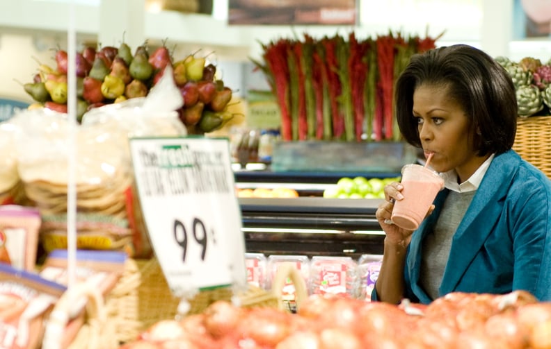 Contemplating what to buy at the store, smoothie in hand, in 2009.