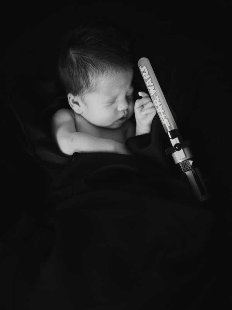 Overcoming the dark side and beating all odds, this little Jedi came into the world with 10 fingers, 10 toes, and a lightsaber.