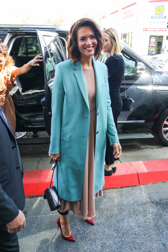 When Mandy attended her Walk of Fame ceremony in 2019, she covered up her nude Emilia Wickstead midi dress with a gorgeous teal coat.