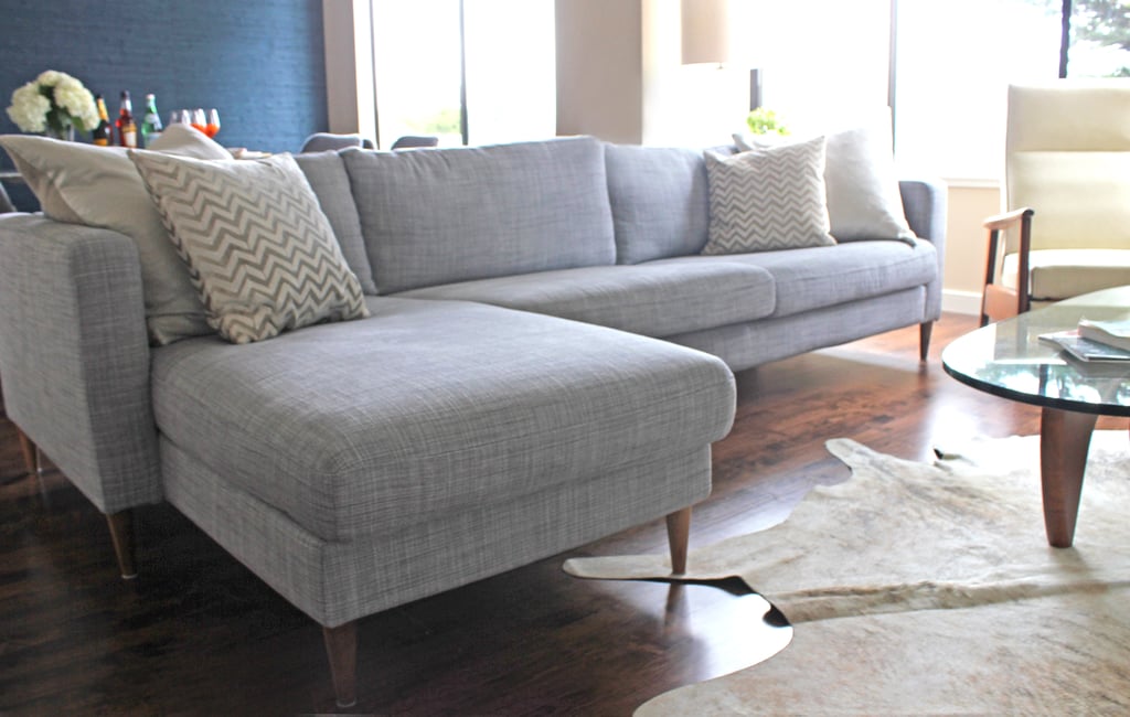 Annie and her husband first decorated her living room with a Karlstad sectional couch that came with classic Ikea birch legs.