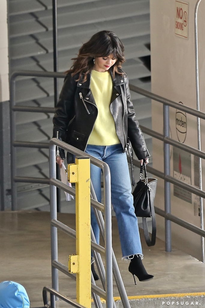 Selena Gomez Wearing Leather Jacket and Yellow Sweater