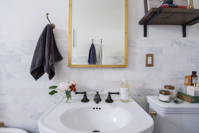 Black-and-White Bathroom With Brass Shower