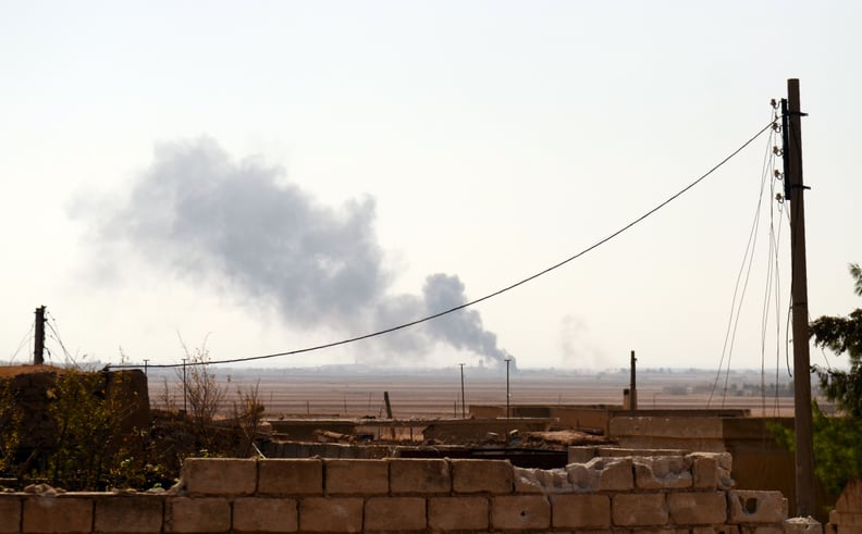 Smoke rises from a government airstrike in a village north of Aleppo.