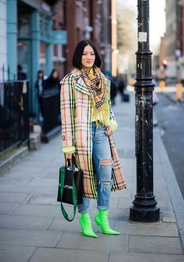 With Ripped Jeans and Neon Green Ankle Boots