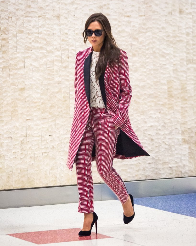Victoria Beckham Wearing Silk Pants at the Airport