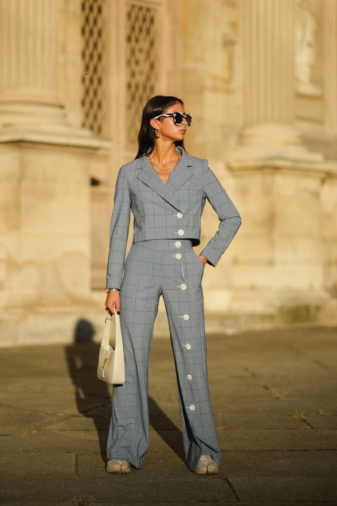 This button-front suit looks sculptural and fashion-forward, and it's a surefire way of standing out in any room. We loved the cropped fit and the fluid hem of the pants.