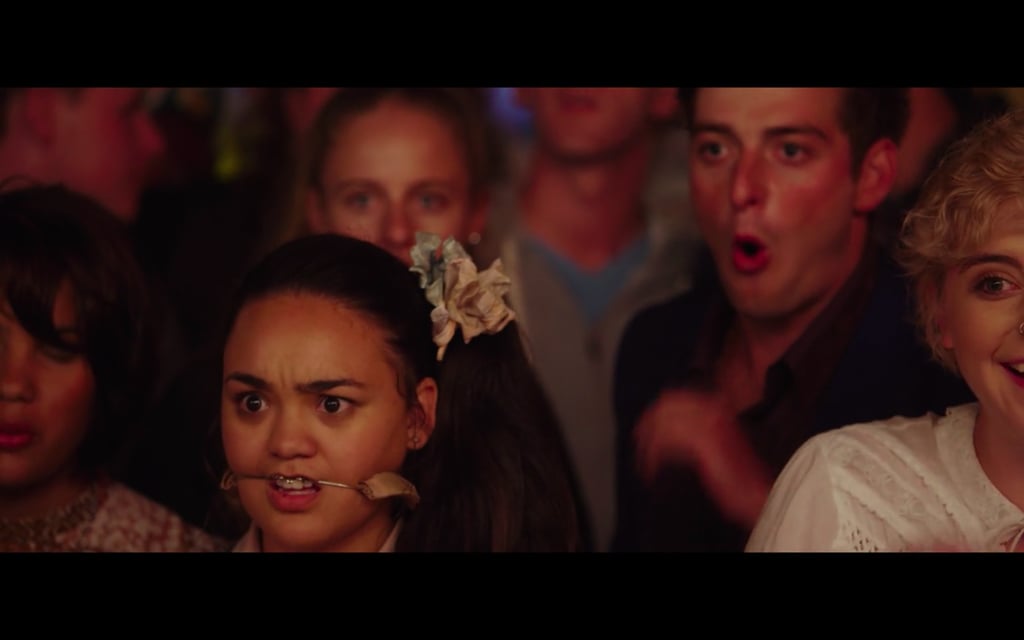 This girl with really uncomfortable headgear is mildly disgusted.