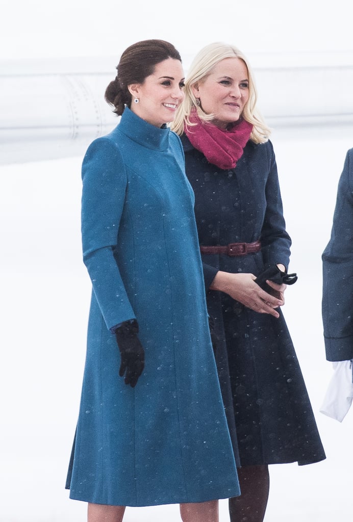 Earlier that day, she wrapped up in her blue Catherine Walker coat.