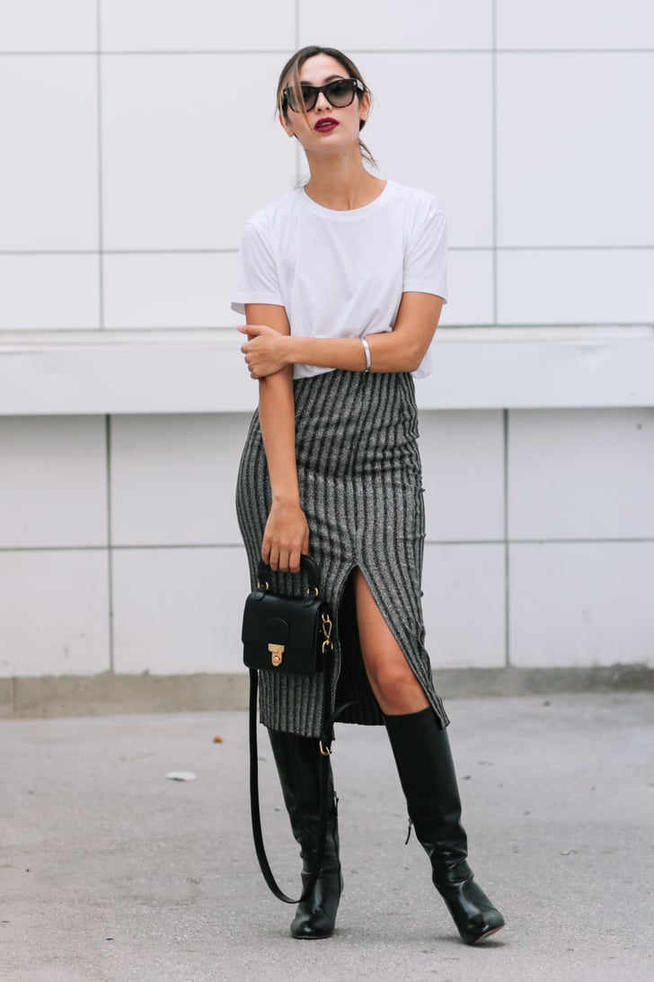 Tuck your white tee  into a knee length skirt to strike 