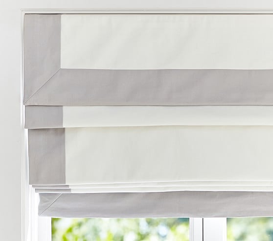 Although the large window provides amazing light, nap times call for darker settings, which is why these cordless blackout roman shades are essential.