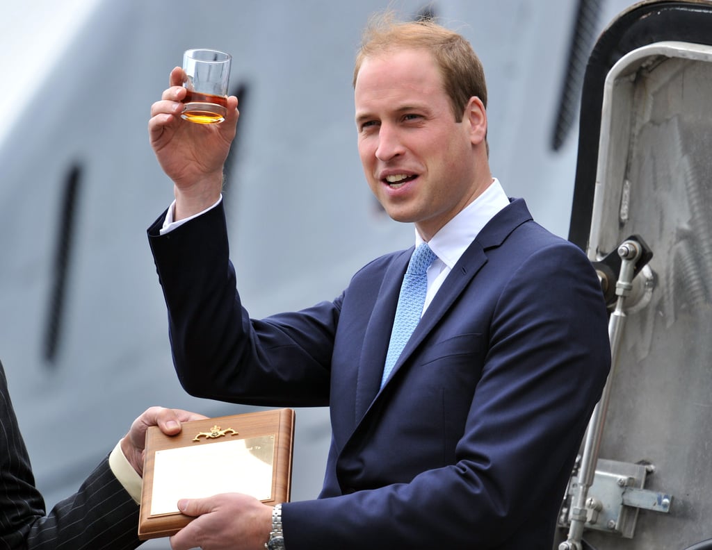 Prince William toasted with a glass of rum at the rededication of the submarine HMS Alliance in Gosport, England, on Monday.